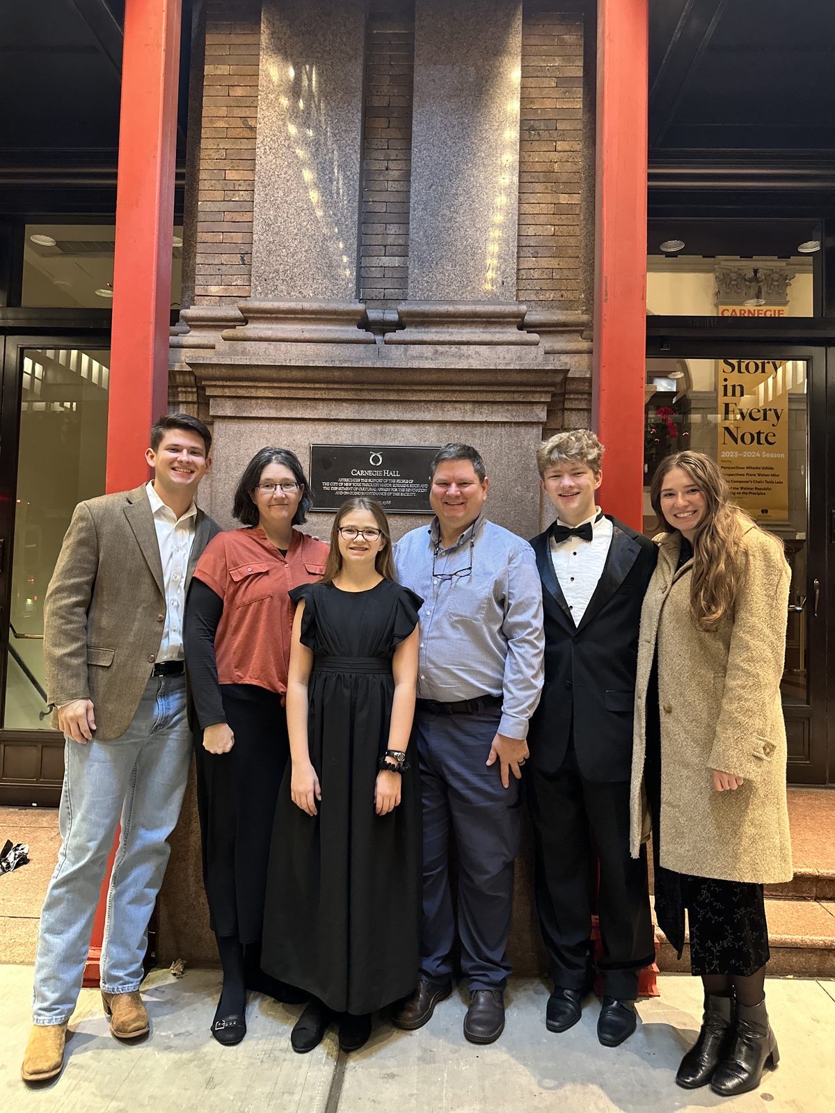 Family members gathered at the Carnegie Hall entrance before a performance